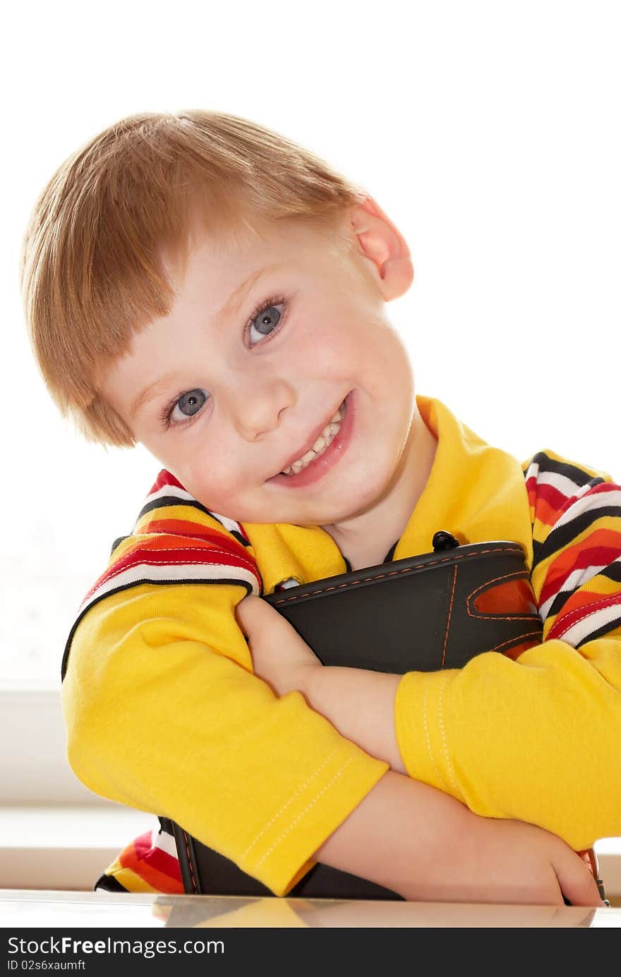 Portrait of the boy with the book in a hand. Portrait of the boy with the book in a hand