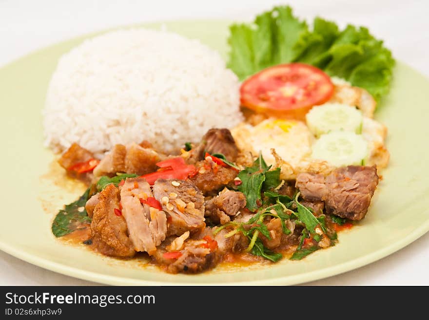 Crunchy pork fried with basil leaf and egg. Crunchy pork fried with basil leaf and egg