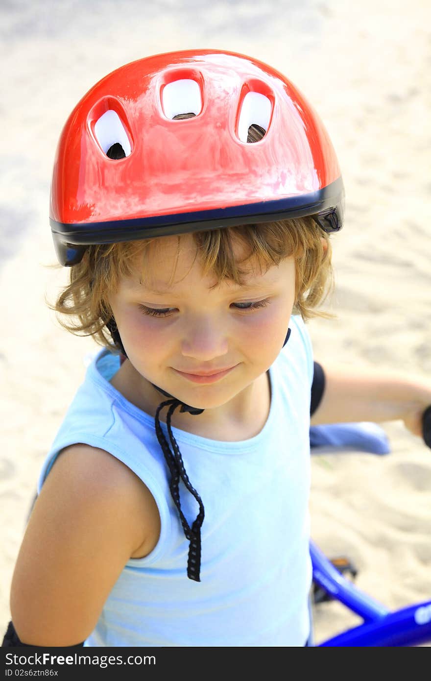 Little girl in a red helmet