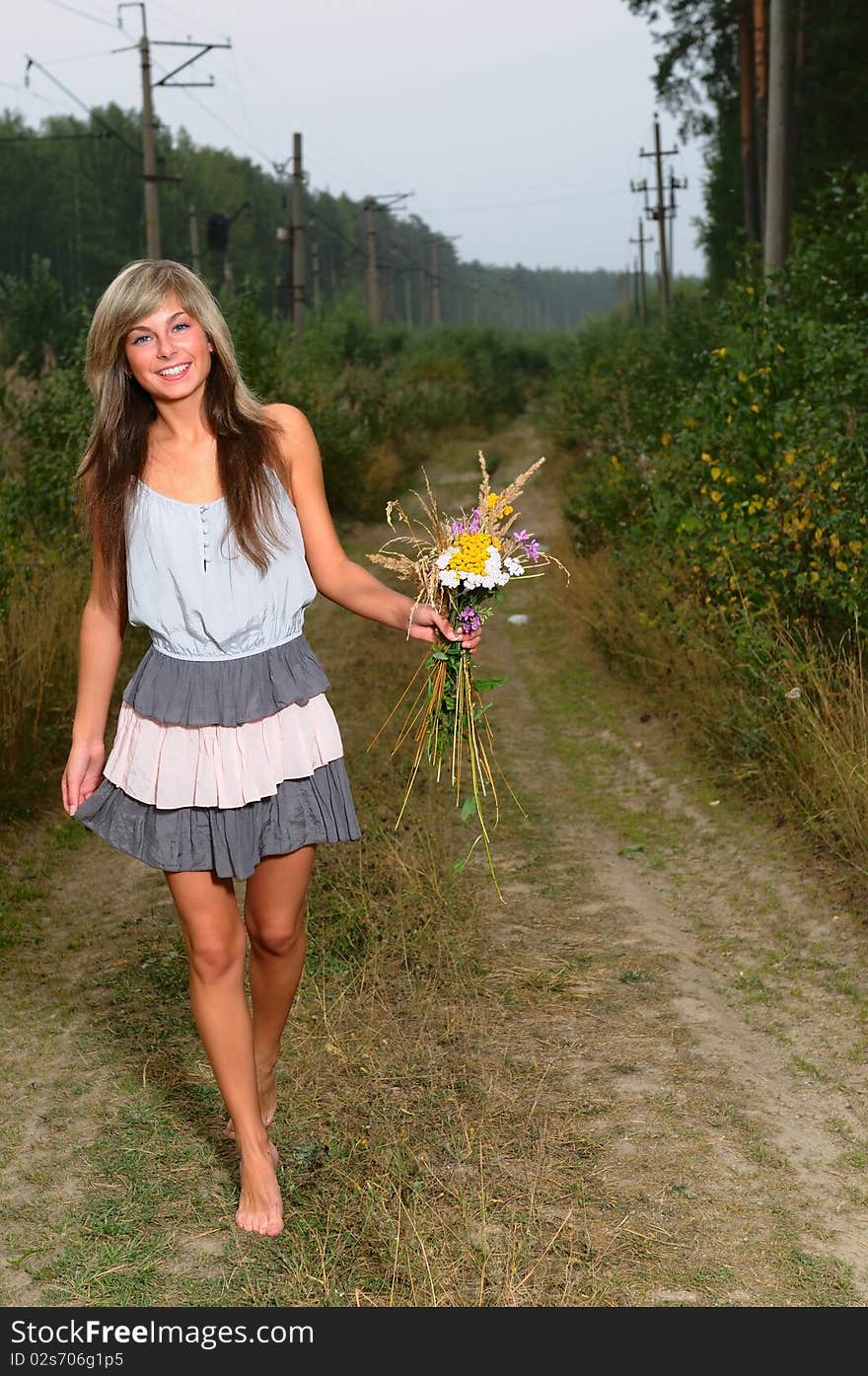 The young beautiful girl at a station