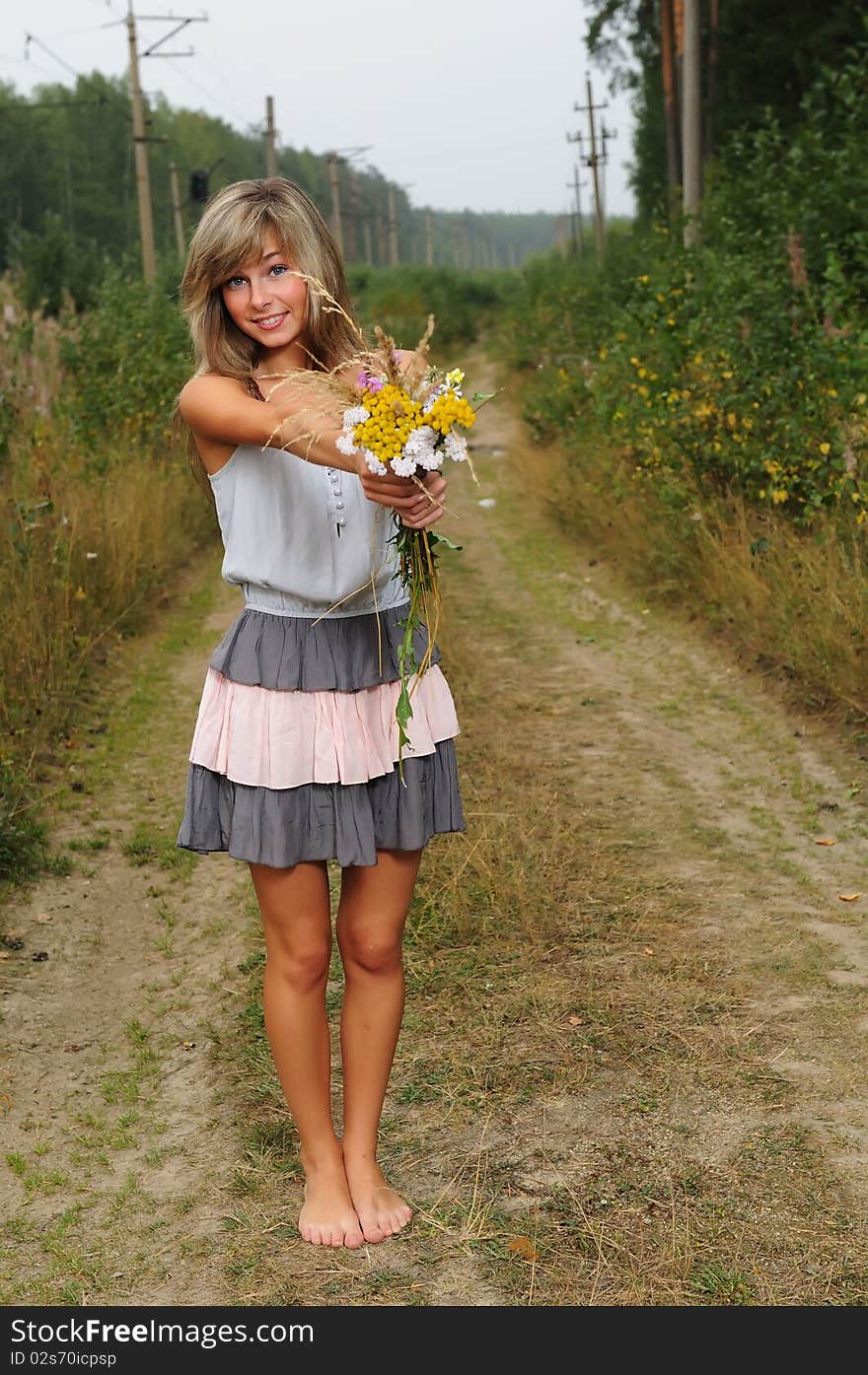 The young beautiful girl at a station