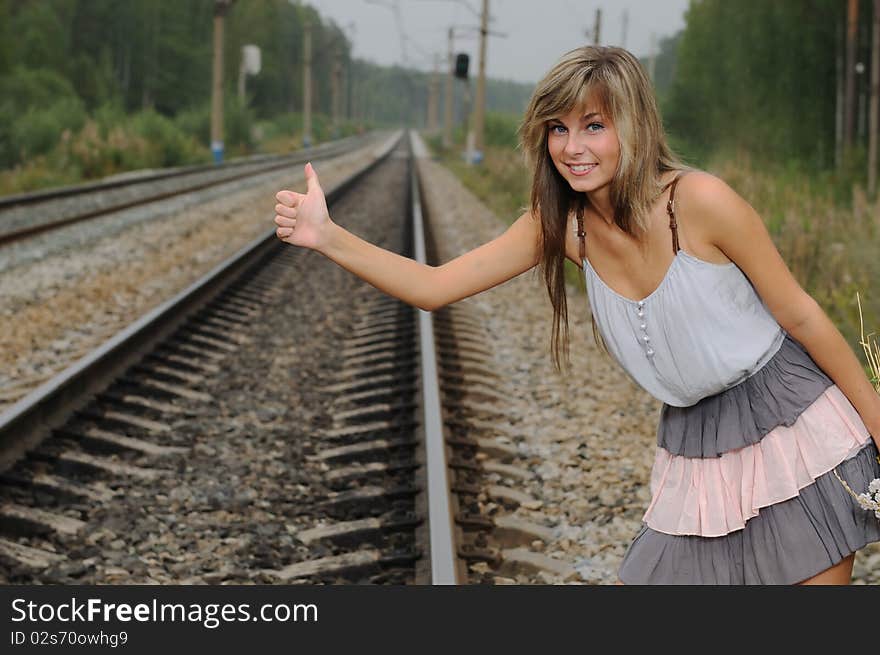 The Young Beautiful Girl At A Station