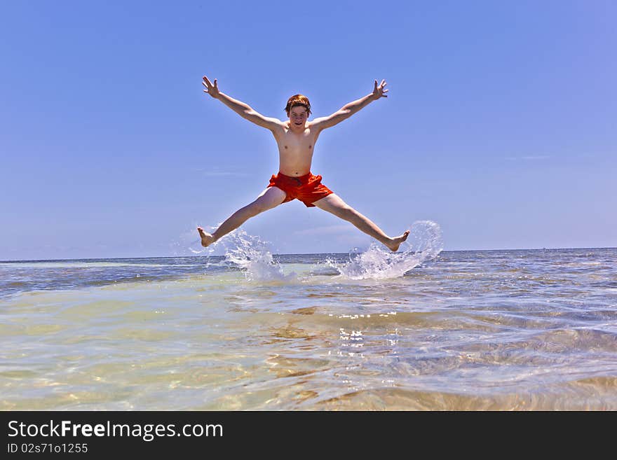 Boy Enjoys The Wonderful Clear Ocean