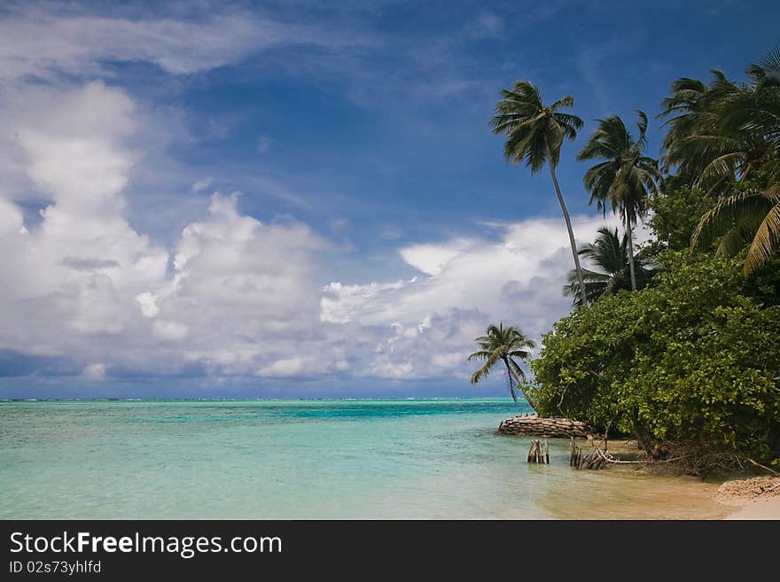 Maldives Medhufushi Island  blue ocean and cloudy sky. Maldives Medhufushi Island  blue ocean and cloudy sky