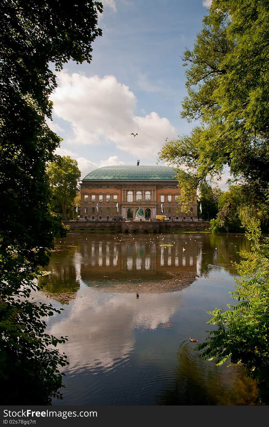 A wiev of a building and pond in the Swan Park in central Düsseldorf. A wiev of a building and pond in the Swan Park in central Düsseldorf.