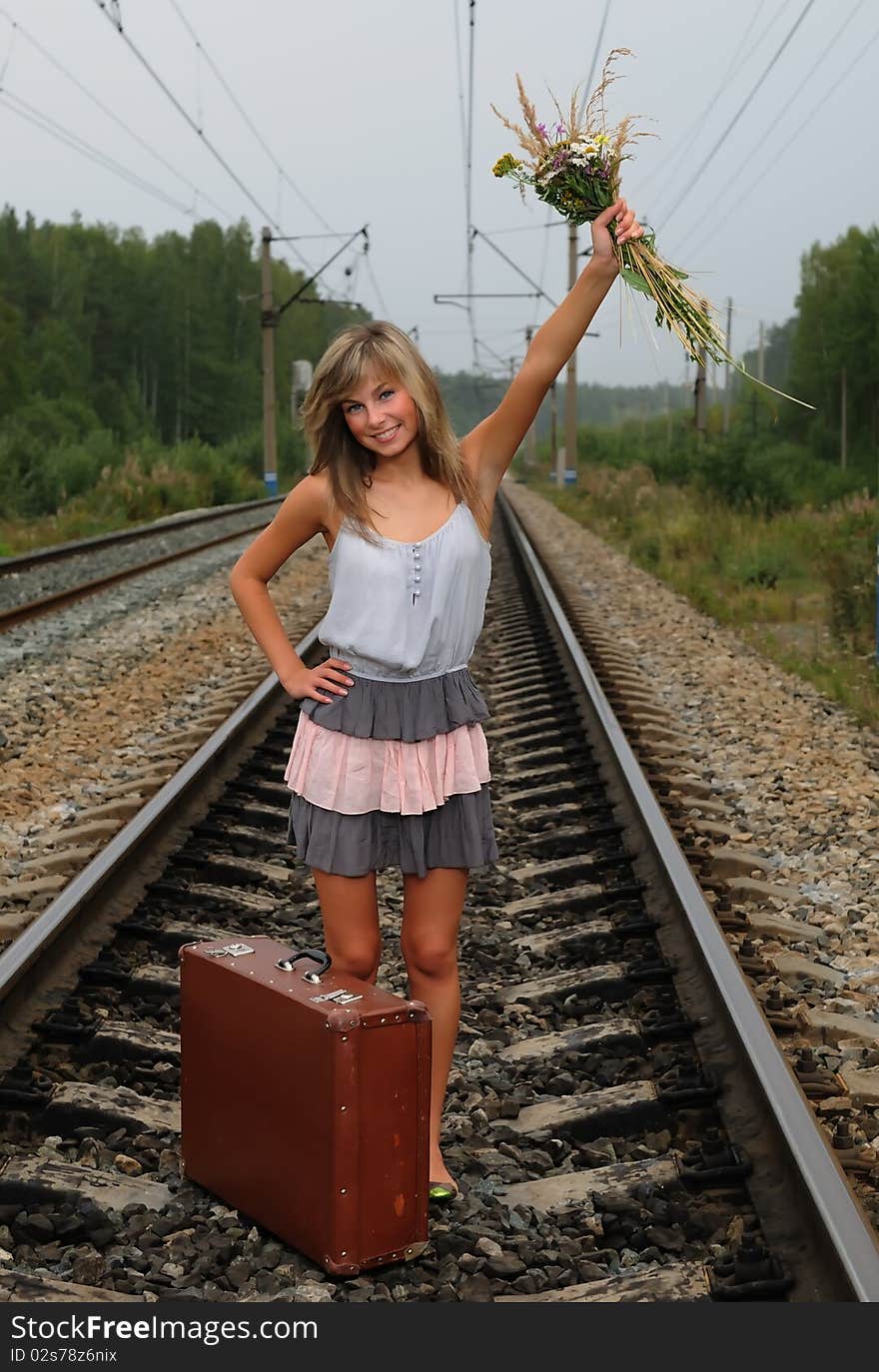 The Young Beautiful Girl At A Station