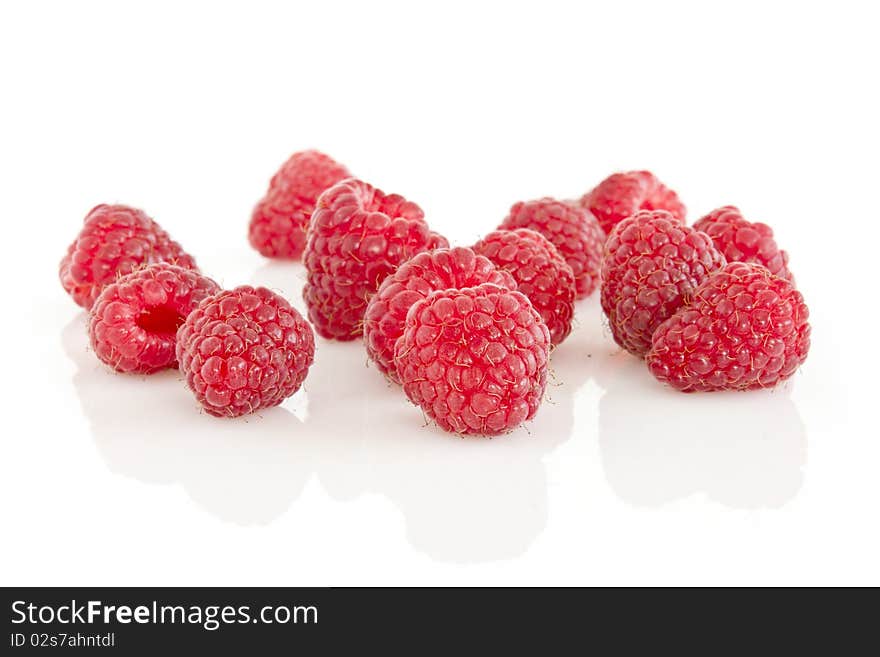 Group of raspberries isolated on white