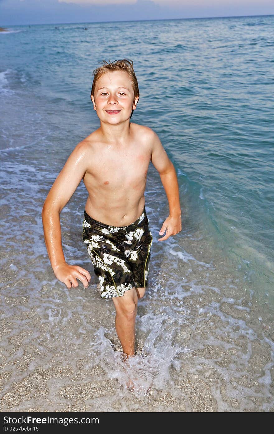 Boy Is Jogging At The Beautiful Beach