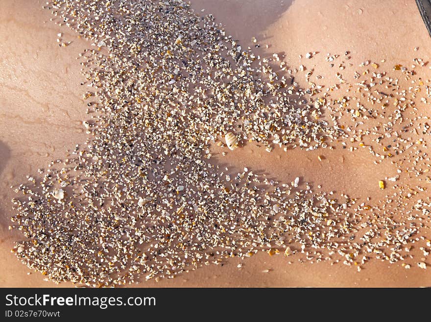 Back of boy with sand