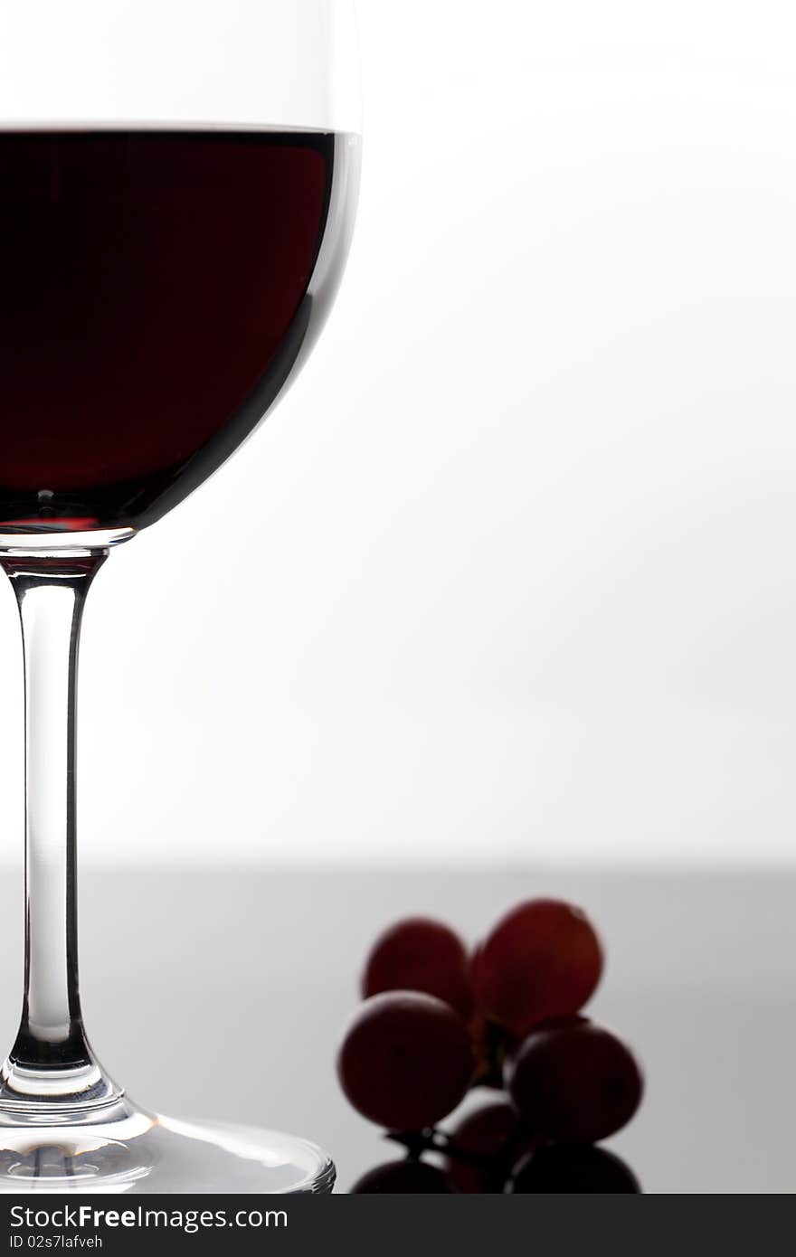 Red wine glass and grape