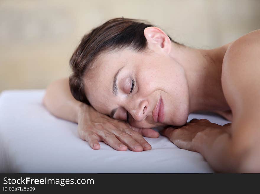 Woman relaxing on a massage bed. Woman relaxing on a massage bed