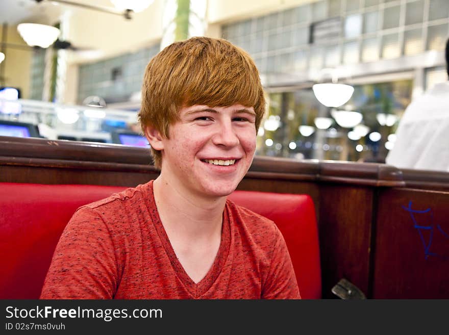 Smiling boy in a diners