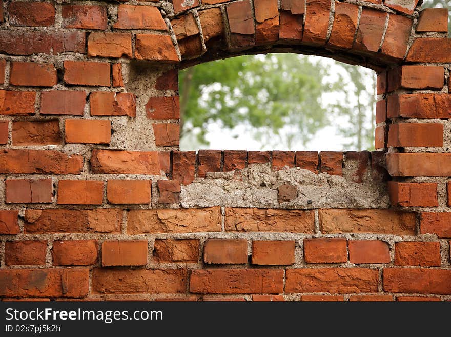 Red old brick framework with window. Red old brick framework with window