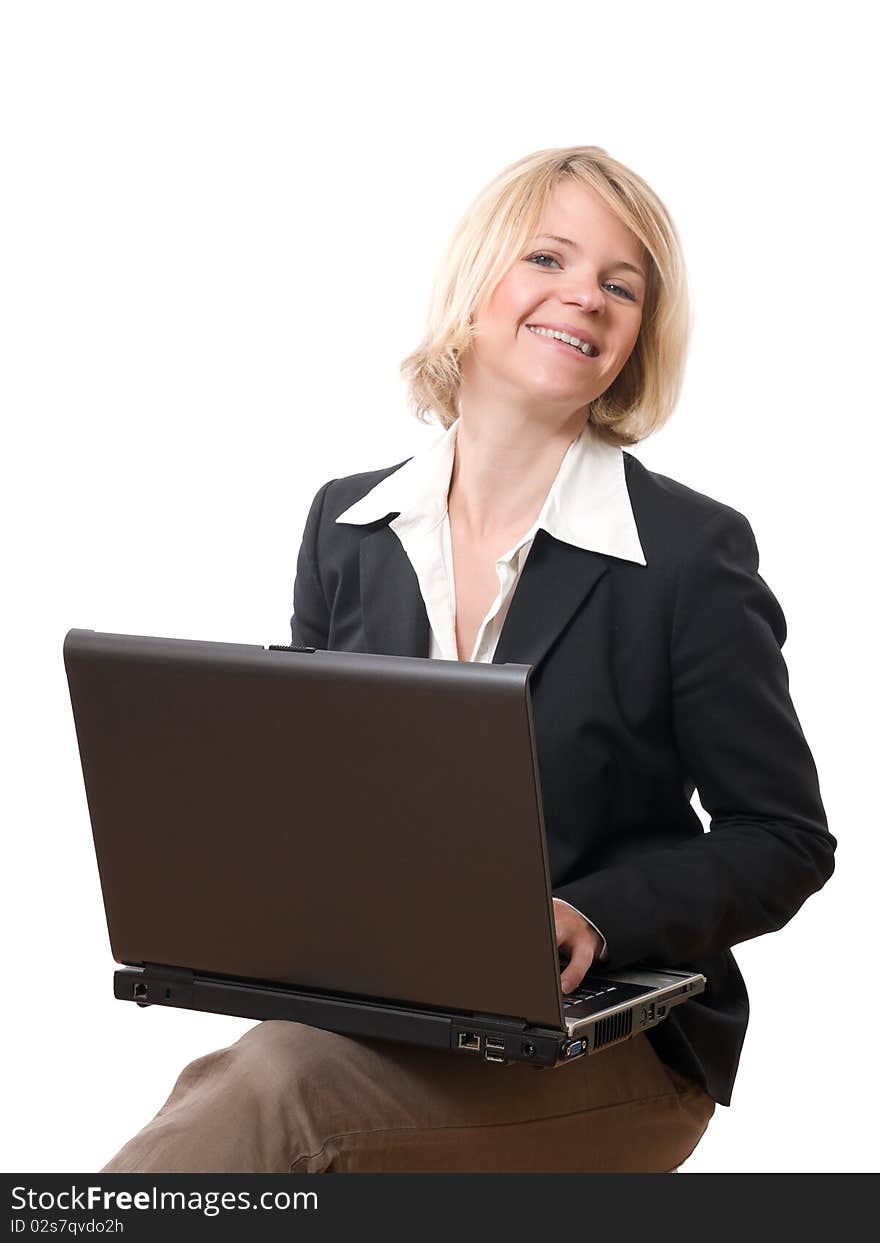 Young smiling businesswoman working with laptop