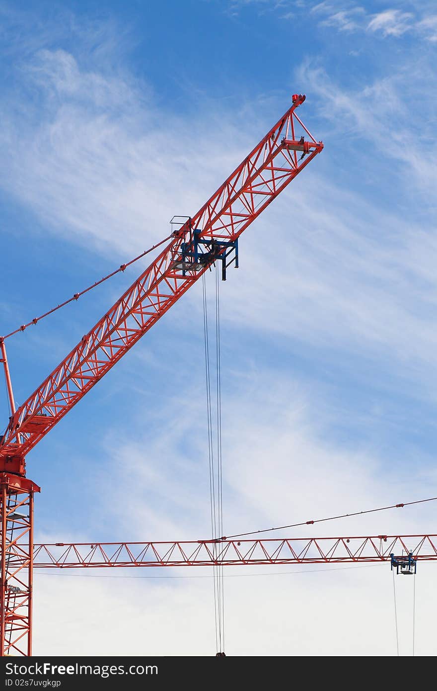 The crane elevating against the sky