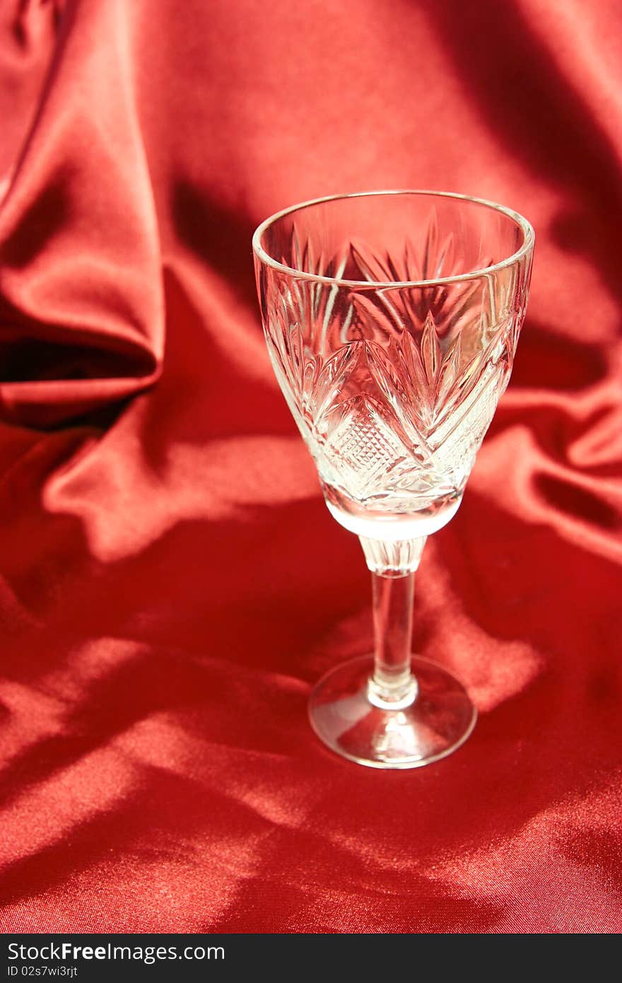 Goblet on the red cloth background