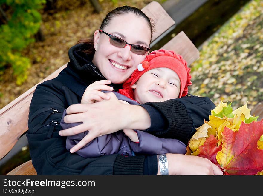 Mother And Child In Autumnal Park