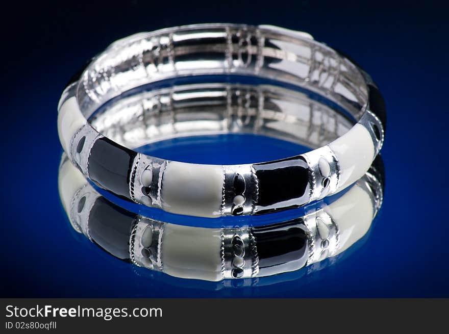 Bracelet with blue background and mirrored