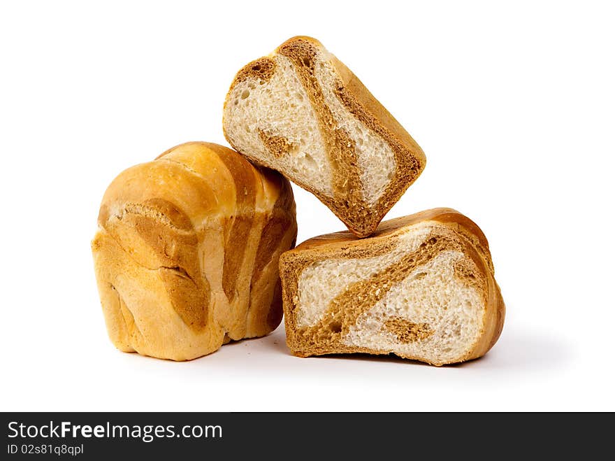 Loaf of bread and two pieces of bread isolated on white background. Loaf of bread and two pieces of bread isolated on white background