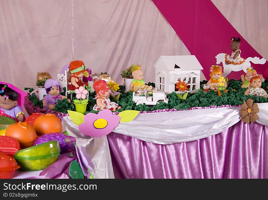 Table full of dolls and toys for children. Table full of dolls and toys for children