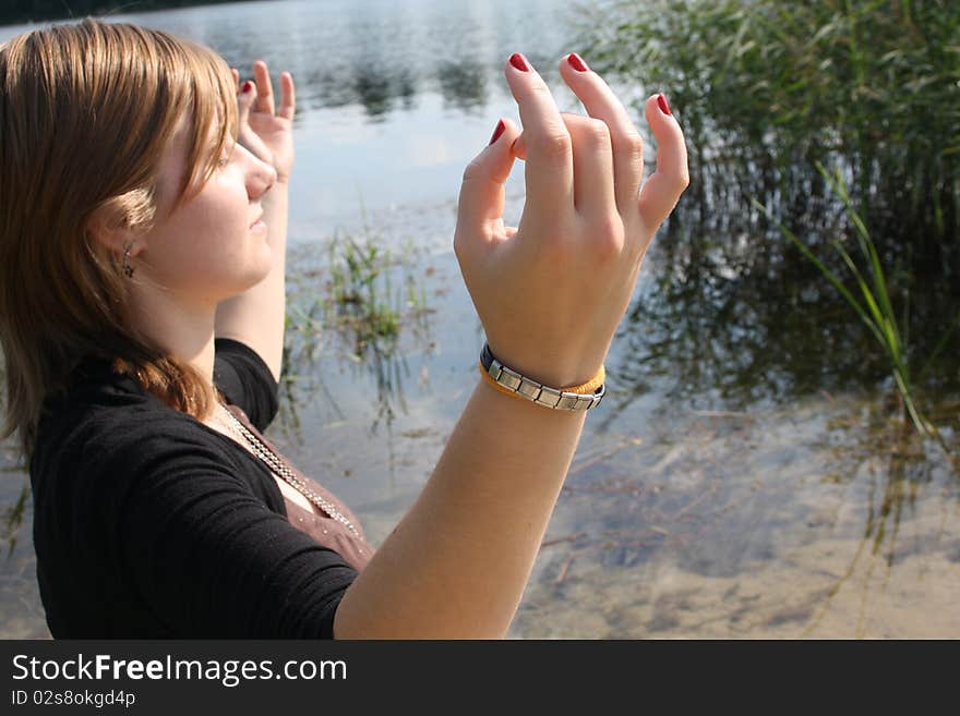 Young woman sitting and meditating. Young woman sitting and meditating