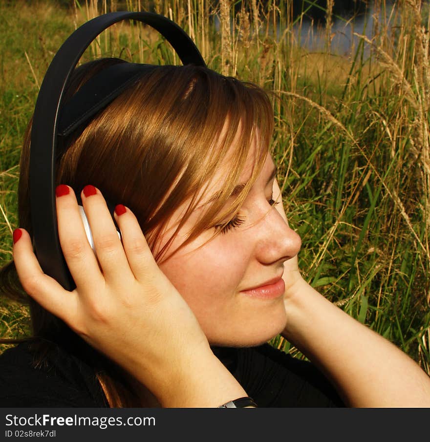 Young woman listening to music.