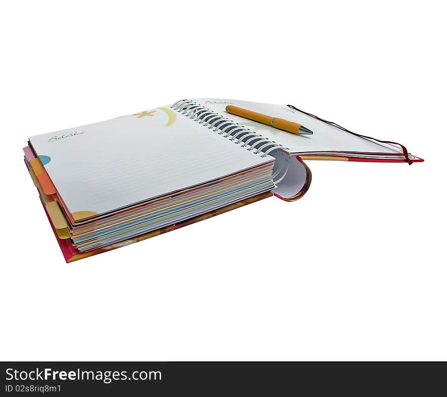 Colorful notebook with pen.
notebook with pen.