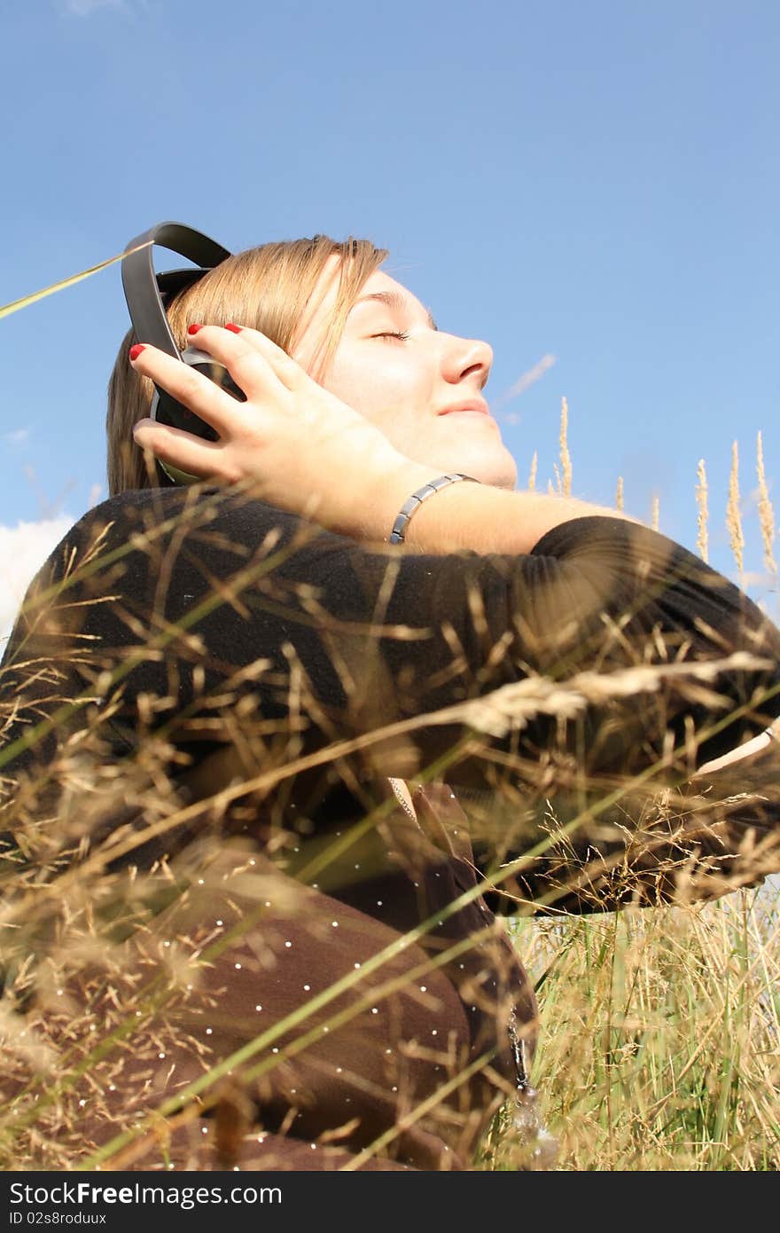 Young woman listening to music.