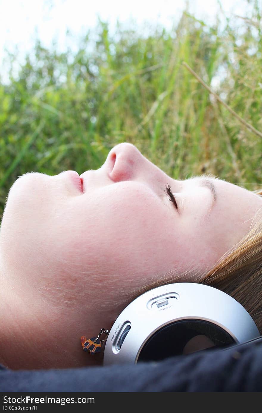 Young woman listening to music.