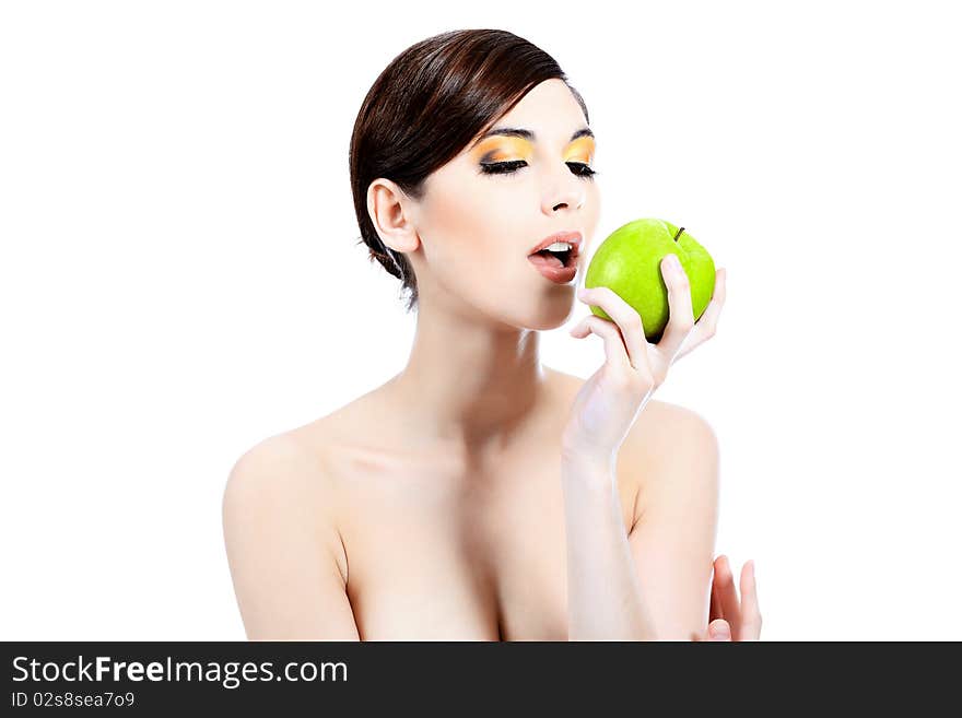 Shot of a beautiful young woman holding green apple. Isolated over white background. Shot of a beautiful young woman holding green apple. Isolated over white background.