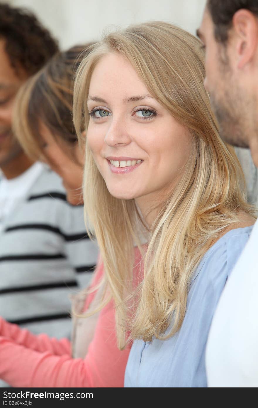 Young And Smiling Blond Woman