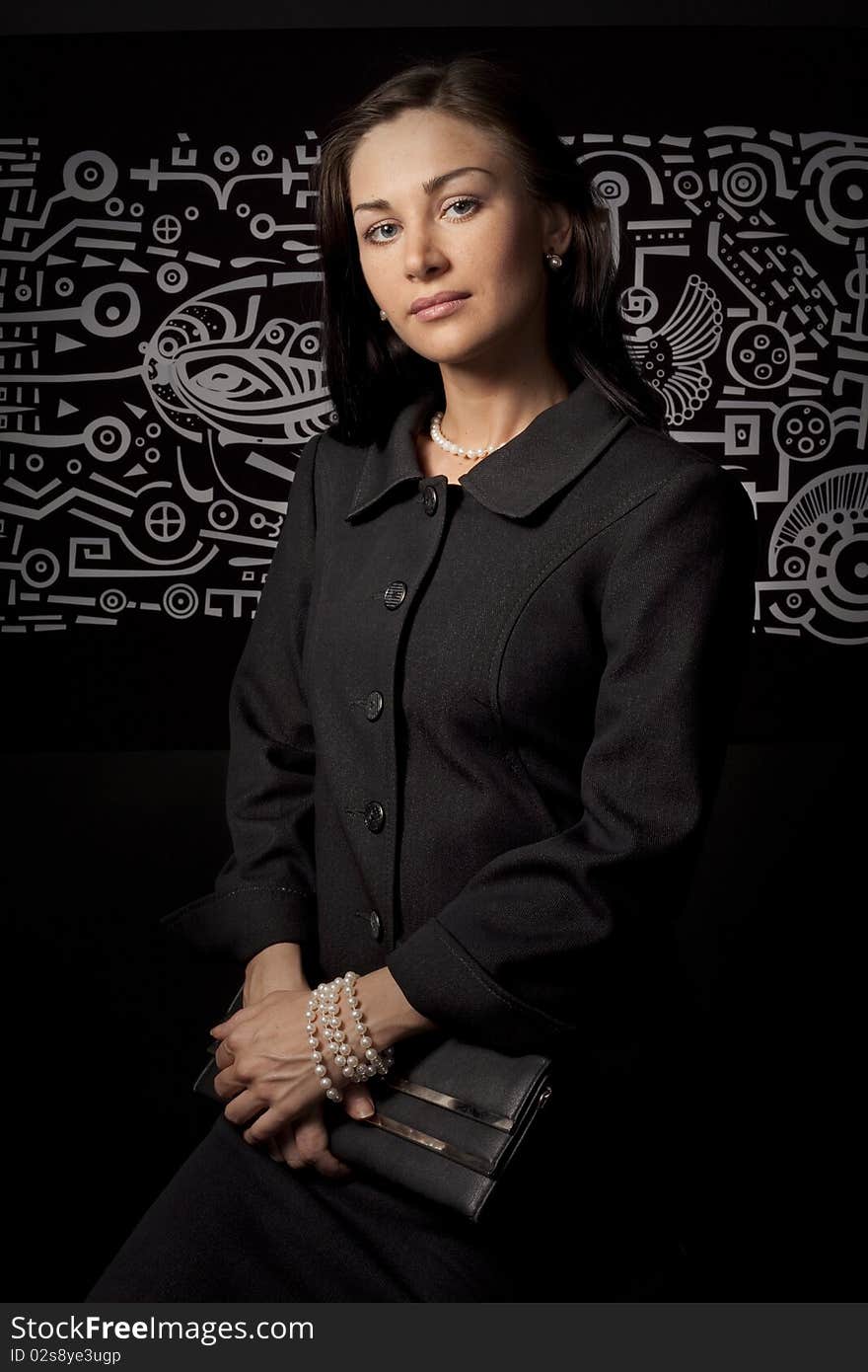 Portrait of business woman on a black