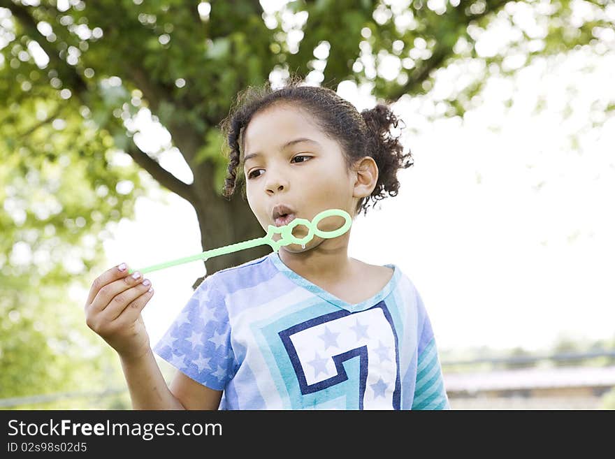 Girl Trying To Blow Bubbles