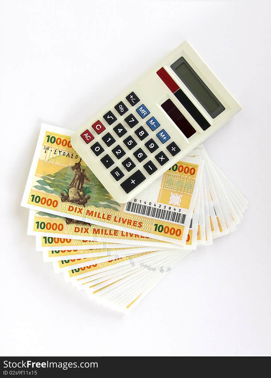 Calculator and money isolated on a white backgorund