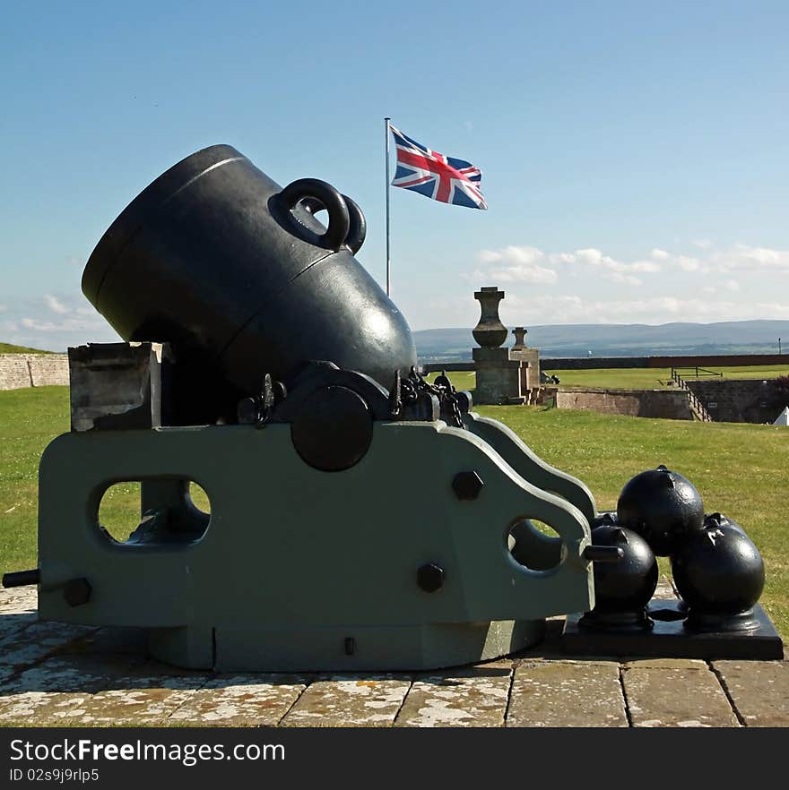 View of a mortar & union flag on the battlements of fort george invernesshire. View of a mortar & union flag on the battlements of fort george invernesshire