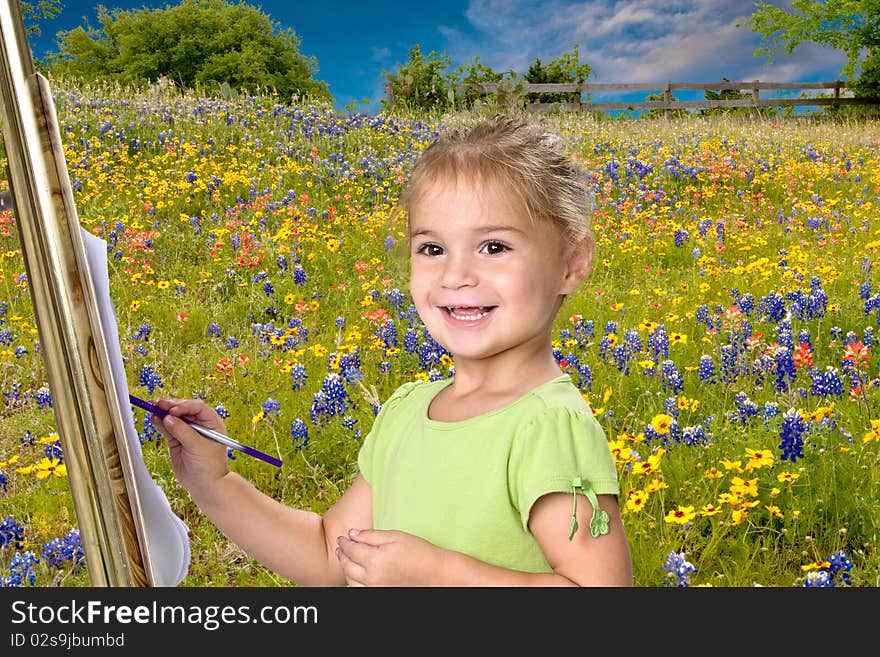 Pretty little 5 year old girl painting bluebonnets on her easel. Pretty little 5 year old girl painting bluebonnets on her easel.