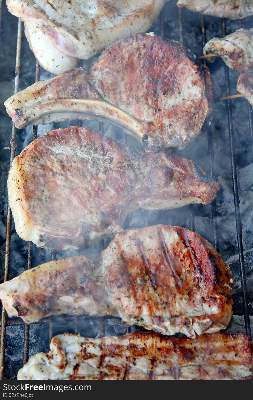 Variety traditional greek grilled meat steaks and chops on rack. Variety traditional greek grilled meat steaks and chops on rack