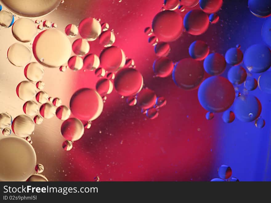 Oil bubbles with blue, red and yellow reflections