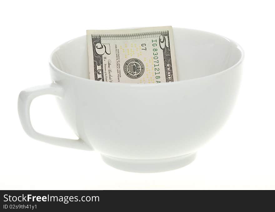 Five Dollar Bill in a White Mug Cup