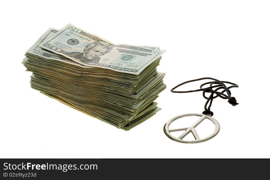 US Currency Twenty Dollar Bills  Stacked next to a peace sign necklace, isolated on white background. US Currency Twenty Dollar Bills  Stacked next to a peace sign necklace, isolated on white background.