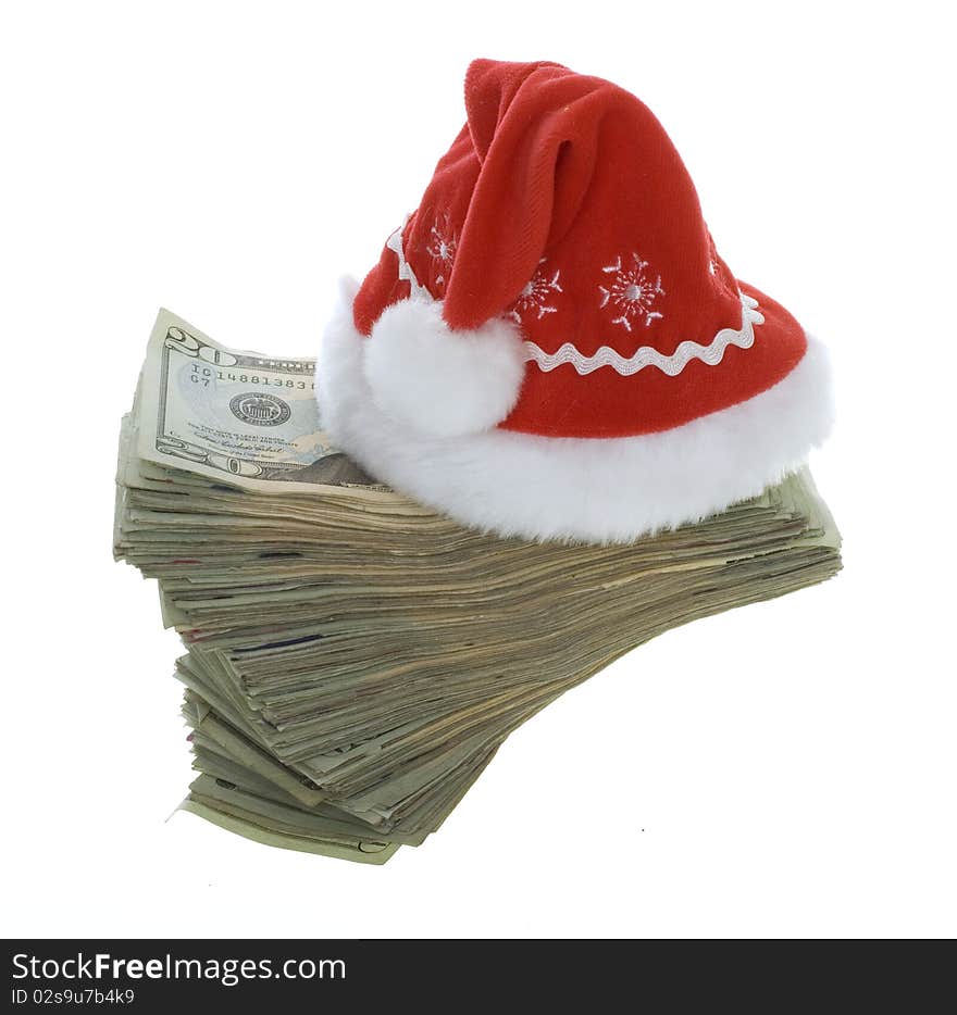 US Currency Twenty Dollar Bills with a red santa hat. isolated on white background. US Currency Twenty Dollar Bills with a red santa hat. isolated on white background.