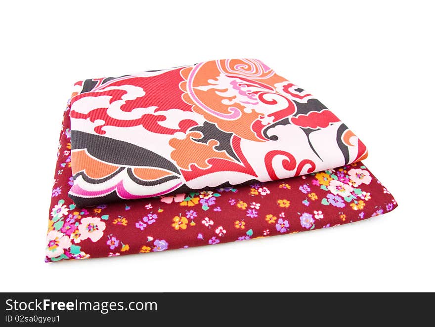 Retro polyester textiles with floral patterns in red. Isolated over white background. Retro polyester textiles with floral patterns in red. Isolated over white background.