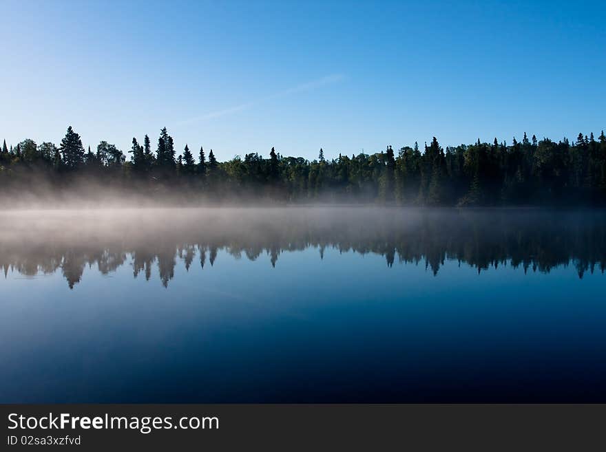 A misty morning on the lake. A misty morning on the lake