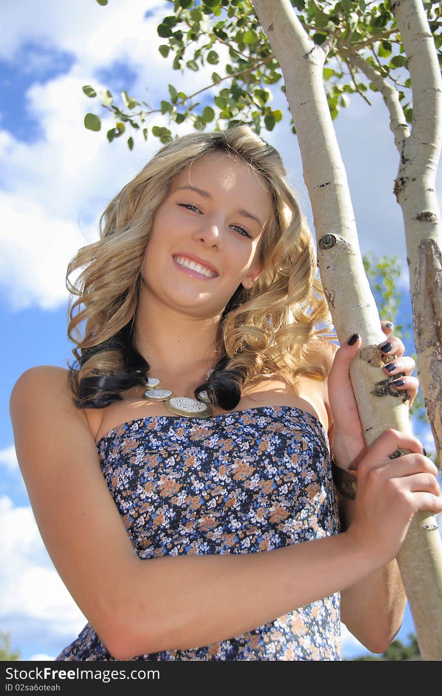 Colorado teenage girl by aspen tree. Colorado teenage girl by aspen tree.