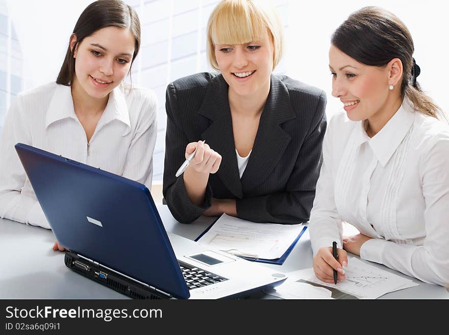 Business women discussing in a meeting. Business women discussing in a meeting