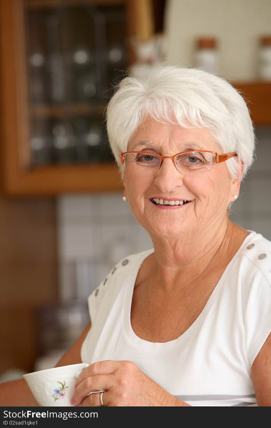 Closeup of senior woman with coffee cup. Closeup of senior woman with coffee cup