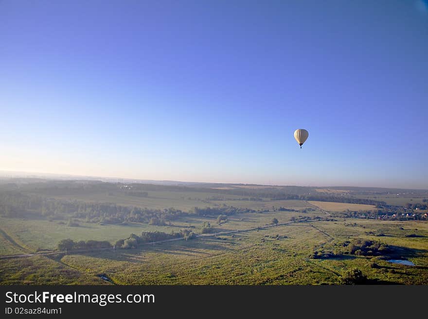 Flying balloon at sunrise