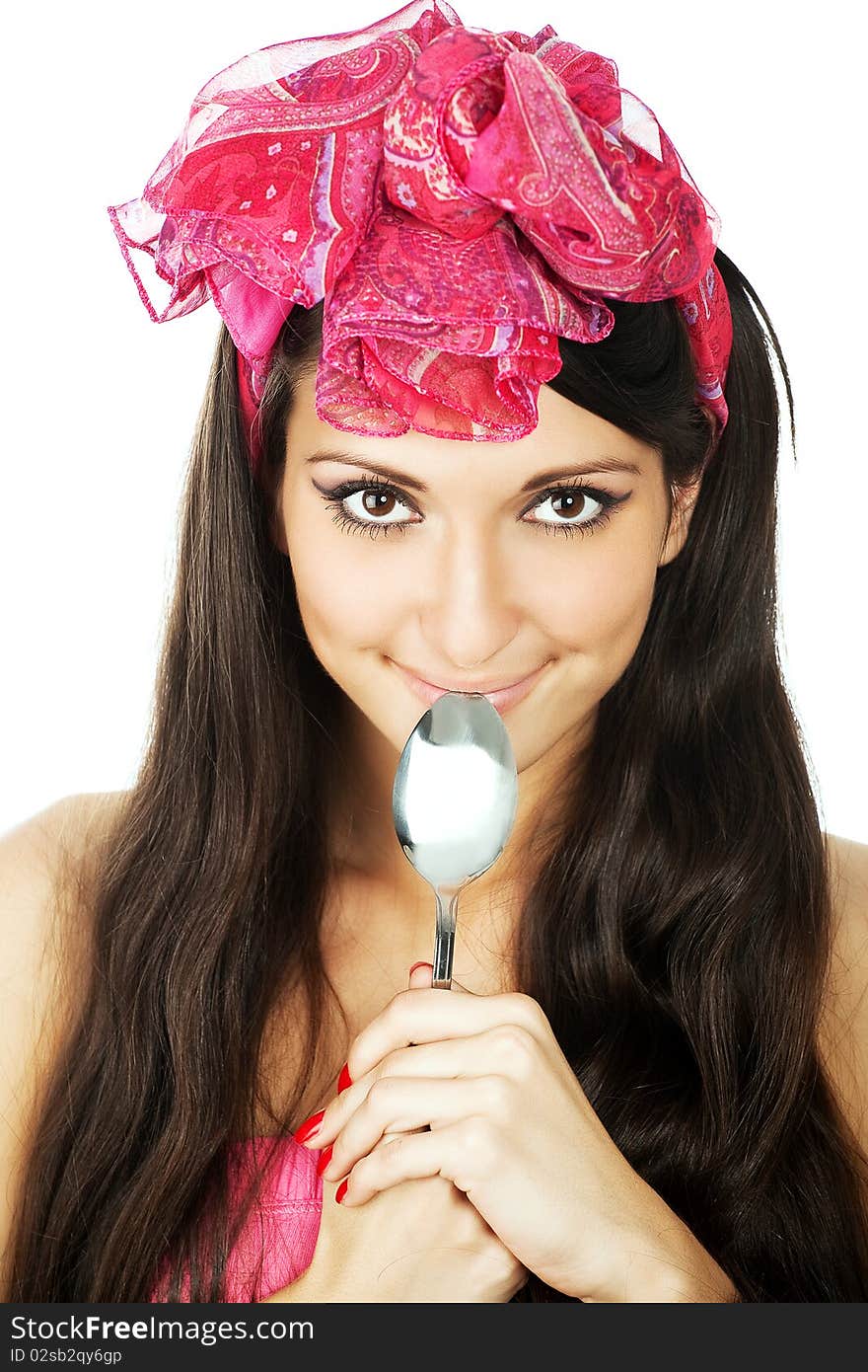 Pretty smilimg woman holding a sppon. Pretty smilimg woman holding a sppon