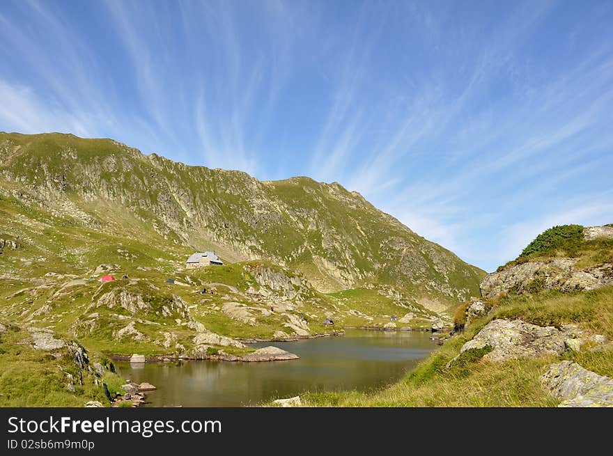 Mountain lake with cabin