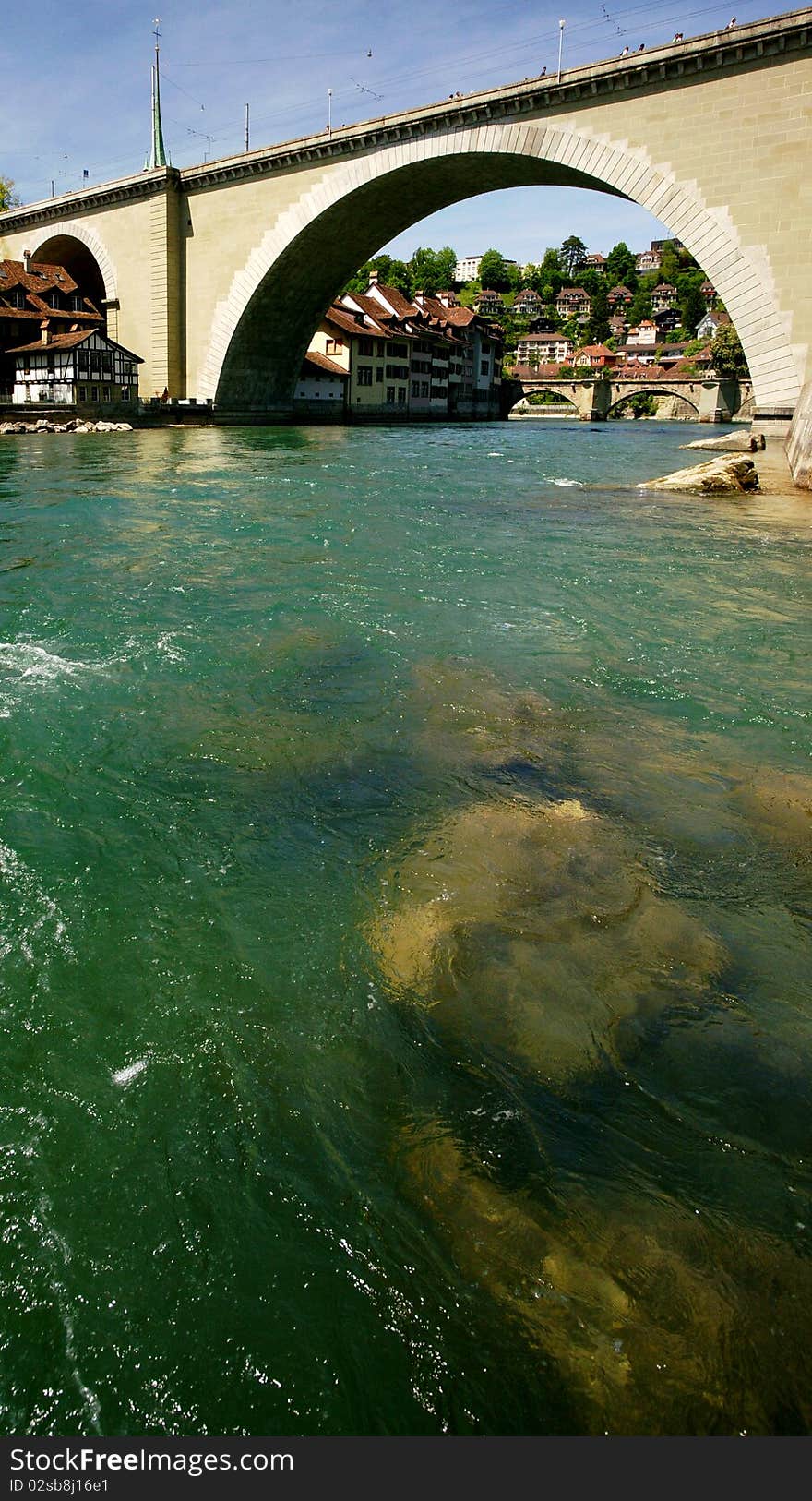 An old bridge is crossing the Aare River in Berne, Switzerland.